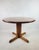 An icon of Danish design in the style of Rainer Daumiller's designs, this round pine table from the 1970s is presented. We...