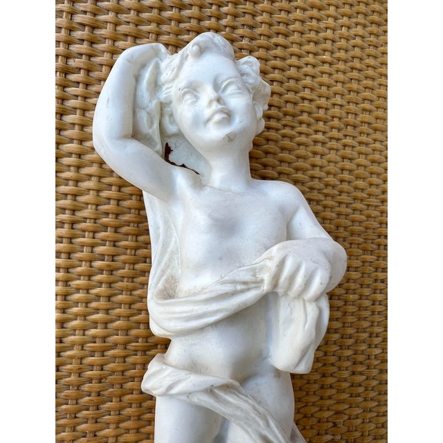 Mid Century Resin figurine statue of a cherub. Made in Italy by Edward P. Paul. Cherubs represent innocence or divine love.