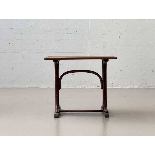 Beautiful children's table in classic mid-century style, crafted from solid wood with a warm, even tone and finely...