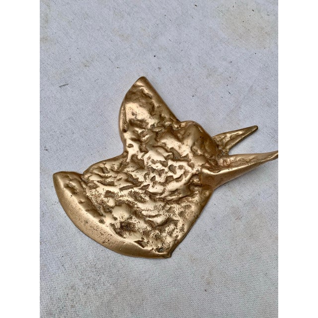 This Early 20th Century Dog Wall Art was crafted from brass in the early 1900's. The piece depicts a meticulously detailed...