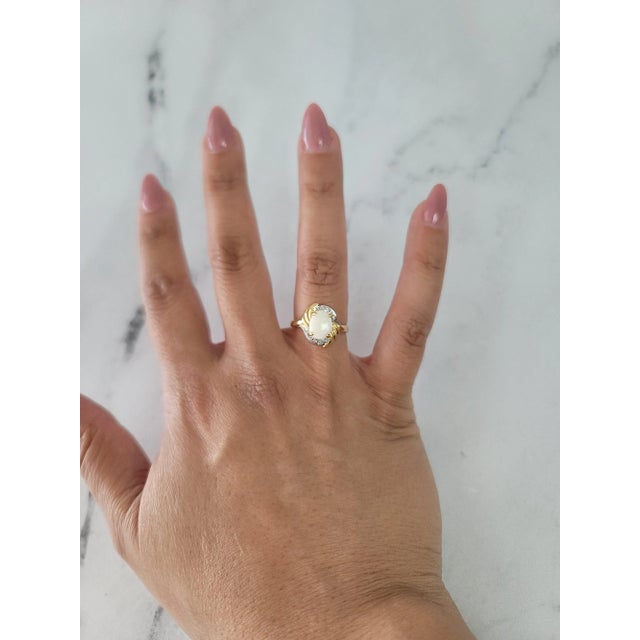 ♥ Product Summary ♥ Stone: Australian Opal & Diamond Stone Cut: Oval & Round Band Material: 14k Yellow Gold Dimensions:...