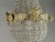 A charming 1980s French Louis XVI–style petit chandelier, crafted in bronze with a warm gold finish. Compact yet highly...