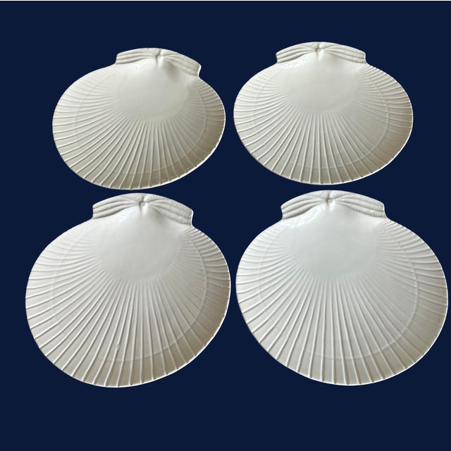Set of 4, 10.5 x 10.5 Bordallo Pinheiro scallop shell dinner plates and a matching set of 4, 8 x 8 salad plates in this...