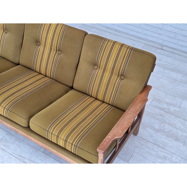 1970s, Danish 3-seater sofa. Furniture wool, solid oak wood, springs in the cushions. Original good condition: no smells,...