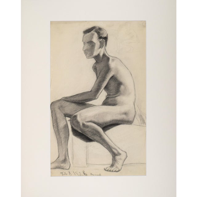An original art deco era figure study of a seated male nude by by Anne Neumark. Charcoal on paper presented matted and in...