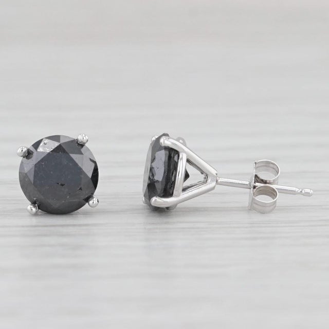 Gemstone Information: - Natural Diamonds - Total Carats - 3.47ctw Cut - Round Brilliant Color - Treated Black Metal: 14k...