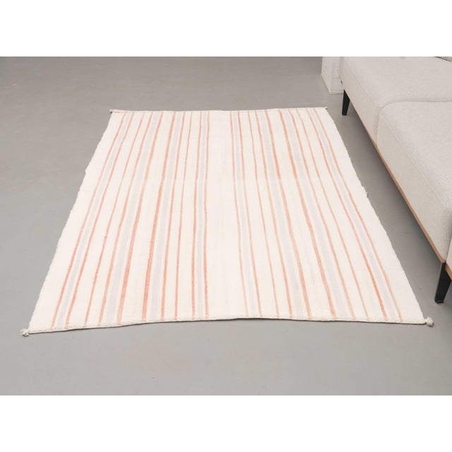 Vintage Hand-Knotted runner rug is a semi-antique vintage area rug. The '70s Eastern region of Anatolia's unique rug is...