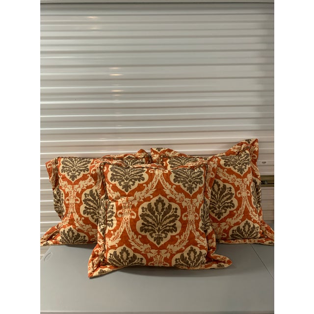 Three large, boldly patterned throw pillows. Very "cushy" as a back prop for reading in bed or "sofa napping." Aged brass...