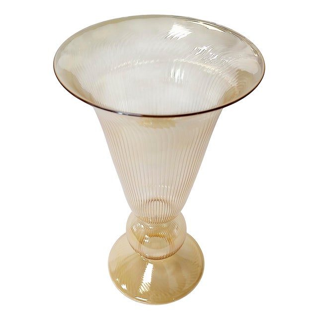 Italian handmade glass vase from circa 1990s. The glass is very thin and light, in ivory color with stripe texture...