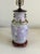 This lovely vintage Chinese porcelain urn lamp features a lavender purple body decorated in a floral motif with unique...