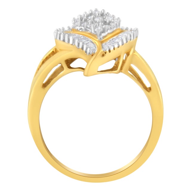 A stunning gold and diamond cluster ring. This pear-shaped ring is made with 22 round and 32 baguette-cut diamonds in a...