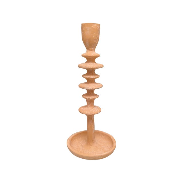 Featuring a tall, tiered silhouette with stacked, rounded discs, this piece creates visual rhythm and movement from base...