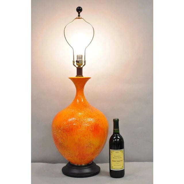 Vintage Mid Century Modern Orange Lava Dripped Glaze Bulbous Ceramic Pottery Table Lamp. Circa Mid 20th Century....