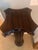 This is a decorative wooden display pedestal featuring classical architectural influences, specifically a column capital...