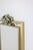 “Boizot” model mirror, in brass, satin varnish finish and pyrite in the upper part, with graphic decoration. Contemporary...