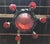 French Art Deco chandelier. Having a center glass bowl with six surrounding tulips in red and blue colored glass. With...