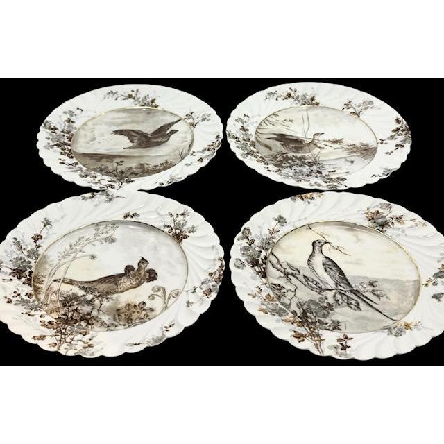 Exceptional collection of four antique Haviland & Co. Limoges porcelain decorative plates, dating to approximately 1887....
