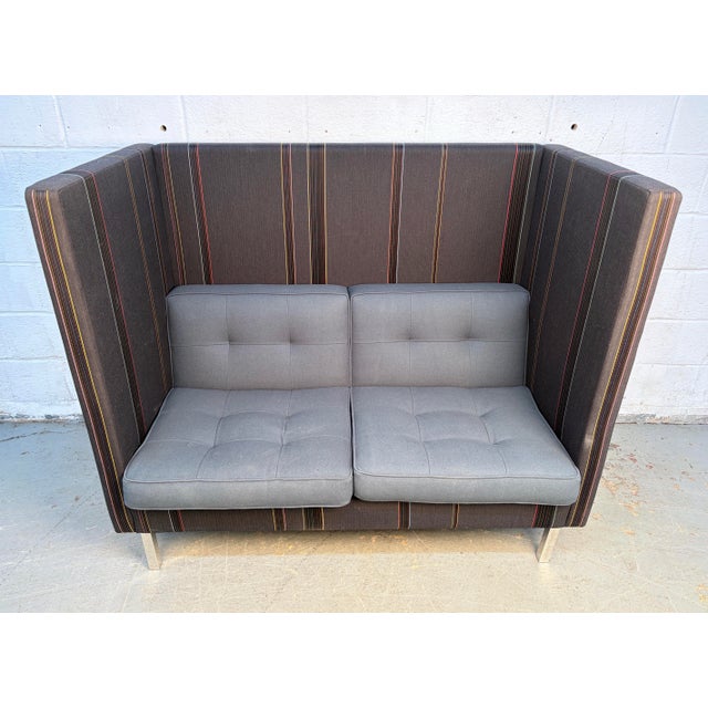 An exceptional Nienkämper Tuxedo High Back two-seater sofa, blending functional design with a distinct mid-century...