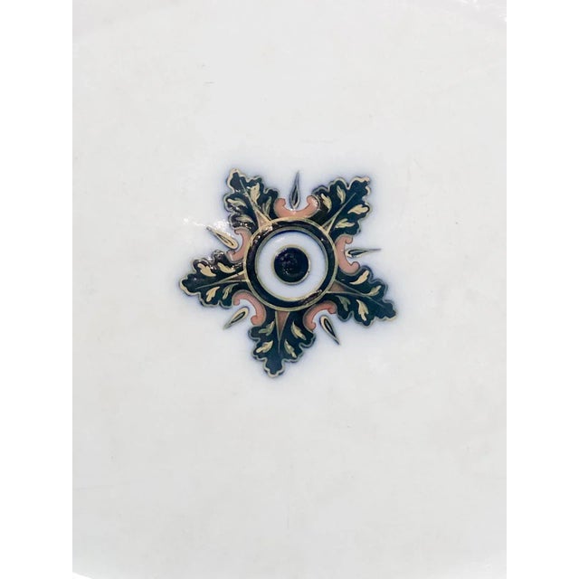 Overall good condition with some wear. This is a hairline crack to the underside of the rim