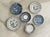 A set of six blue and white plates in a variety of sizes. Churchill England Saucer- 5 1/2 inches in diameter, 1 inch tall...