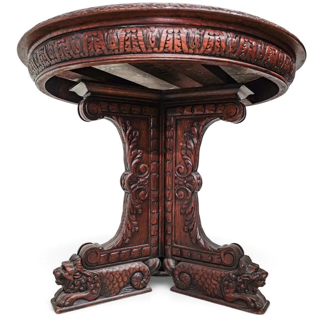 This Antique Marble Top Carved Oak Round Table, made in Belgium, is a stunning piece of furniture for any room,...