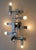 Geometrical chrome light that holds six-light fixtures on vertical and horizontal square arms. This flush mount ceiling...