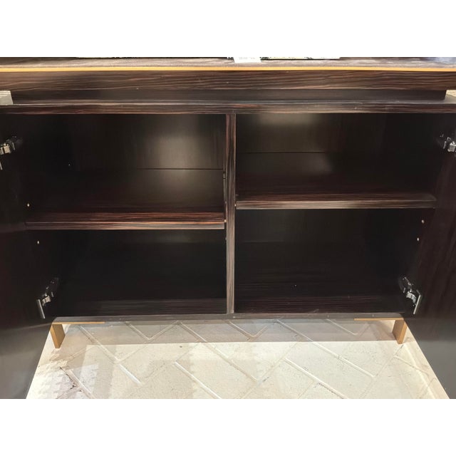Elegant Caracole Signature Hightower Bookcase. Suede interior, with 3 shelves on top. Dark brown wood. Gold accents....