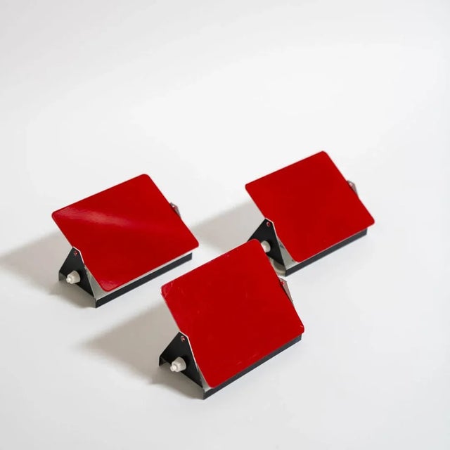 The iconic enameled wall lights by Charlotte Perriand from the 1960’s designed for the apartments of the ski resort Les...
