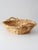 Beautifully woven vintage wicker basket with sculpted wooden handles, a thick braided rim, and a warm natural finish. Its...