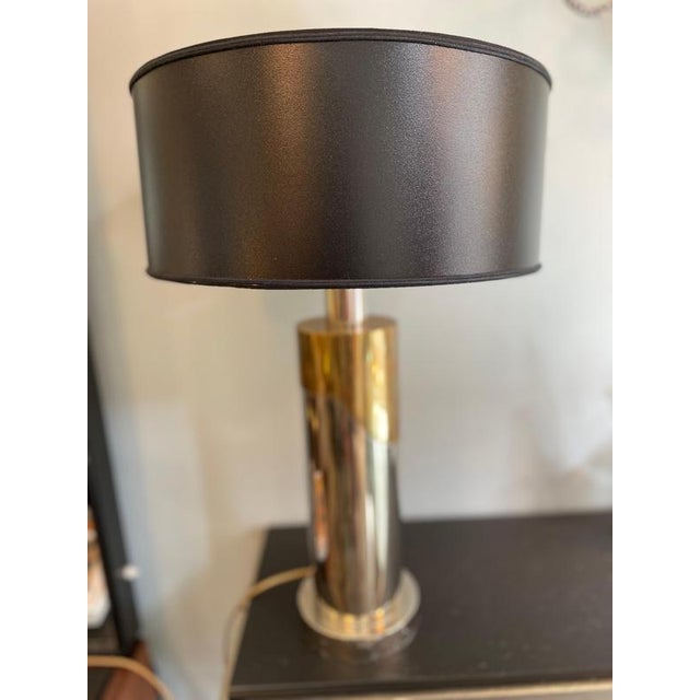 Cylindrical lamp with brass and steel base from the 1970s, Italy. Measurements: Base diameter 12cm, lampshade diameter...