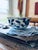 Beautiful vintage Japanese porcelain bowl featuring a rich royal blue floral and leafy branch design against a soft...
