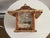 This charming birdhouse is made primarily of birchbark in shades of white, beige, gray and brown. The birchbark represents...