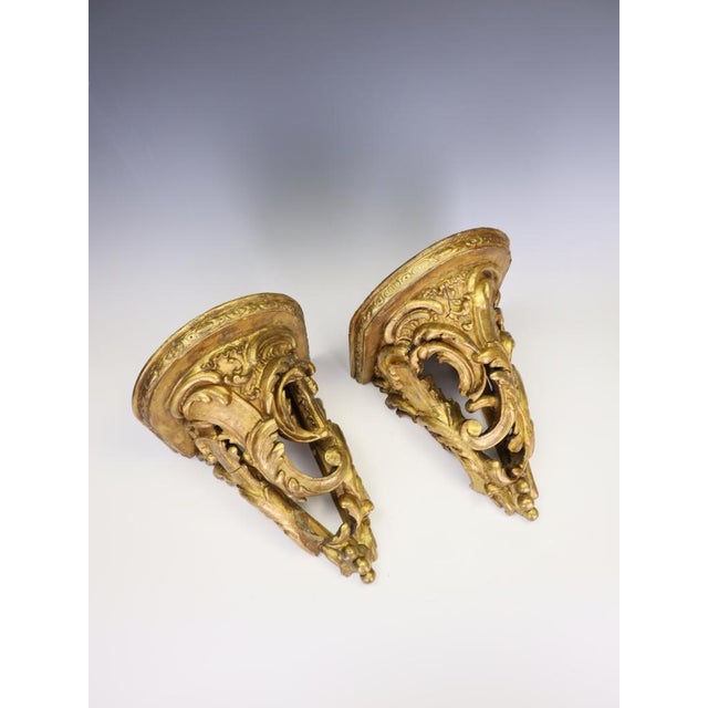 Pair of Antique 19th Century Rococo Revival Giltwood Wall Brackets / Shelves An exceptional and highly decorative true...