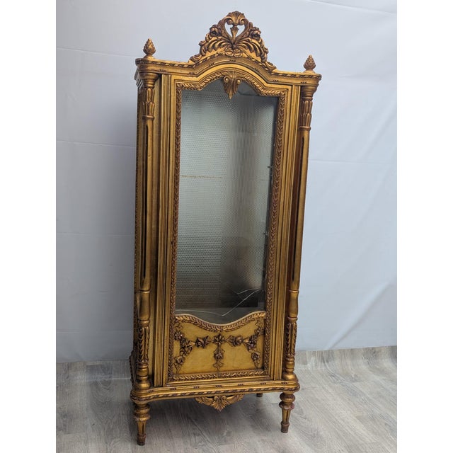 Gilded Illuminated Baroque Display Cabinet This Baroque school display cabinet is often described as antique. It features...