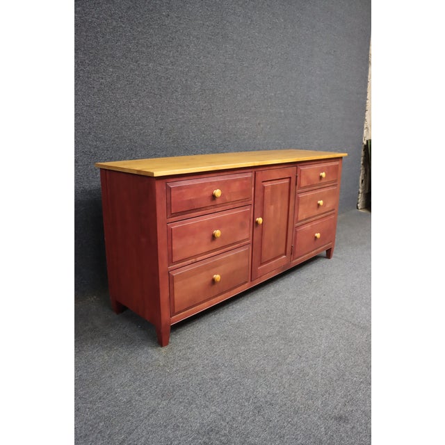 Ethan Allen dresser from the popular Country Colors collection, featuring a warm red painted finish paired with a solid...