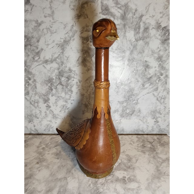 Vintage 1960s Italian Leather Glass Decanter in shape of water bird with long neck. This is a handmade brown leather...