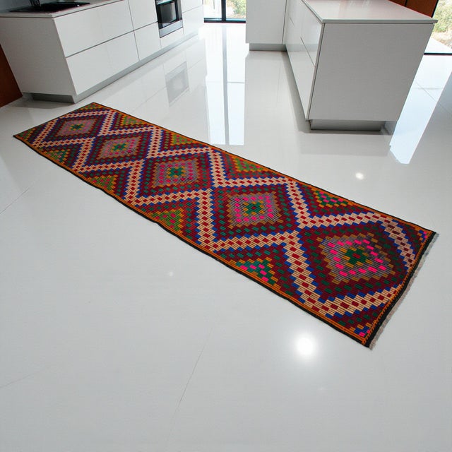 Woven in the 1960s on a village family loom in the Denizli region of Western Turkey, this long cicim-embroidered runner is...