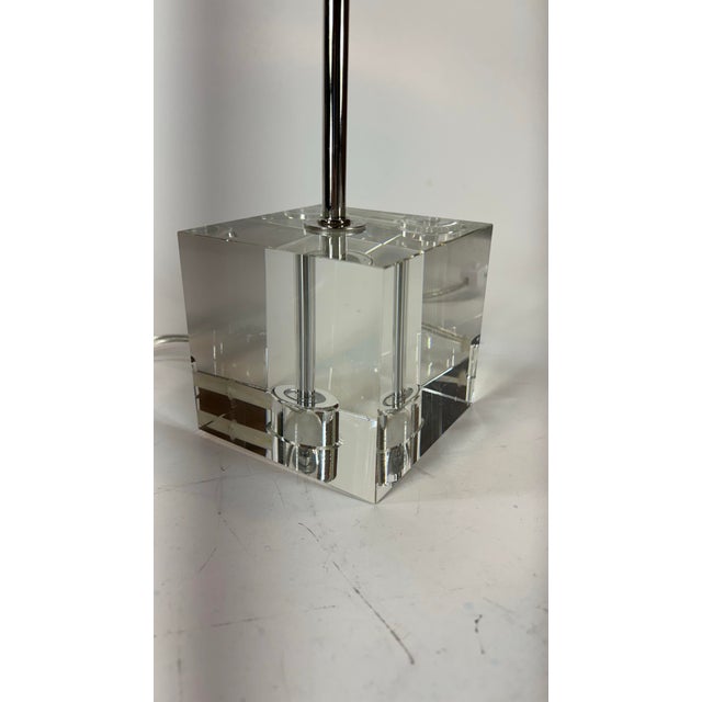 This vintage chrome gooseneck tabletop lamp with a glass cube base offers a unique and stylish addition to any room. The...