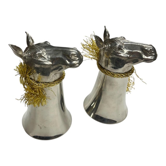 Fantastic set of two silver plated horse flagons. Base is a realistic horse head that holds the flagon once it has been...