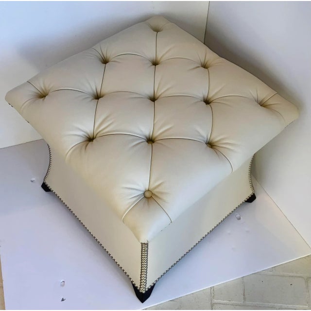 Original retail $2721, stylish transitional Theodore Alexander White Tufted Leather Ottoman, silver finished nailhead...