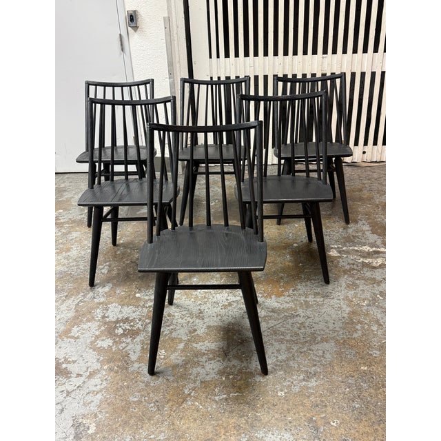 Design Plus Gallery presents a set of four Lewis Windsor Chairs from Four Hands. Black oak construction displays...