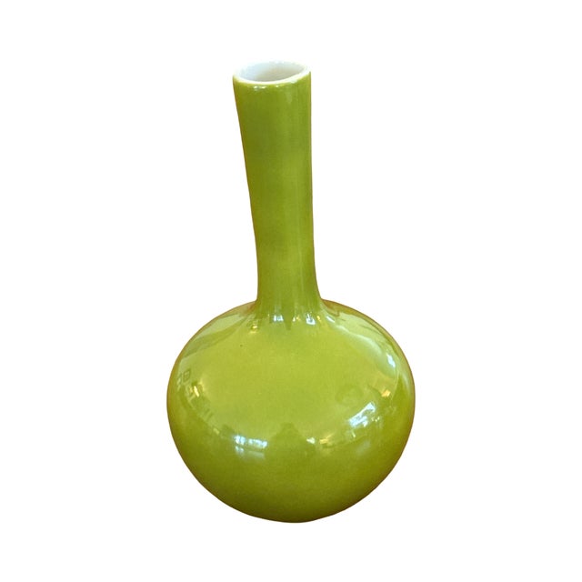 This striking 6-inch ceramic bud vase is a quintessential example of 1960s modernist design. Finished in a brilliant,...