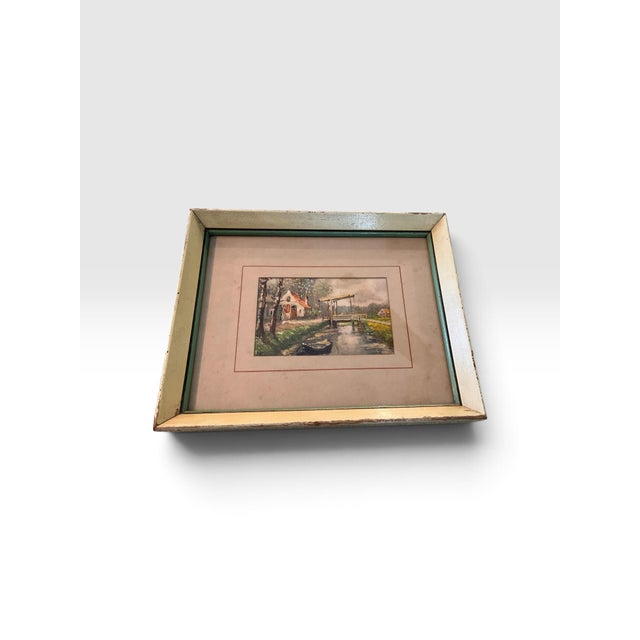 Charming vintage original landscape painting depicting a tranquil European countryside waterway with a rustic cottage,...