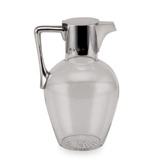 20th Century Edwardian silver & plain glass wine jug, the glass mounted with a plain solid silver collar and hinged lid....