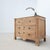 A beautiful antique 19th-century chest of drawers, crafted from walnut and cherry wood, with fir side panels. It features...