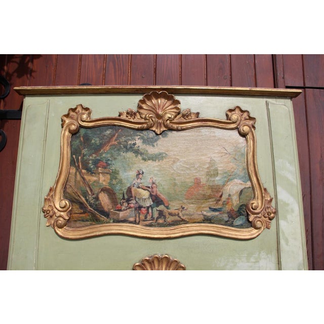 Large Louis XV Regency style trumeau mirror in giltwood with green highlights pastoral scene painted on the top, needs...