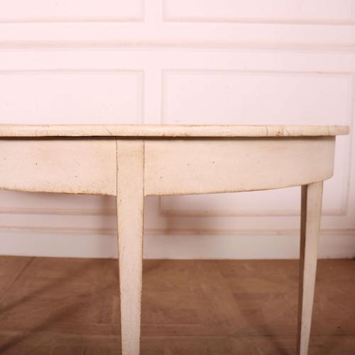 Pair of 19th C Swedish Demi lune console tables with a painted faux marble top. 1830 This piece is designed in the style...
