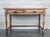 A charming early 20th century Spanish pine farm table with four legs and back side trestle and a wonderfully well-worn...
