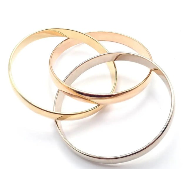 Gold 1990s Cartier Trinity Rolling Tricolor Gold Large Model Bangle Bracelet For Sale - Image 8 of 9