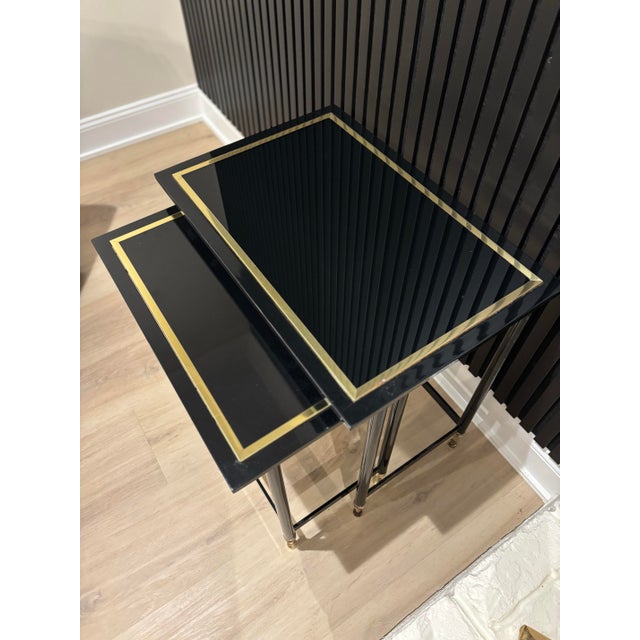 Offered is a vintage set of Hollywood regency style nesting tables by Design Institute of America. This regal set is all...